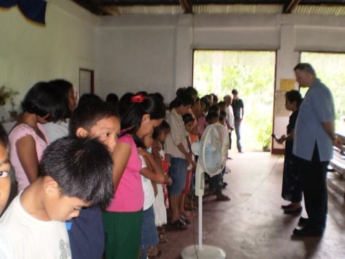 Pastor Paul and Pastor Nena pray for new believers in Guimaras